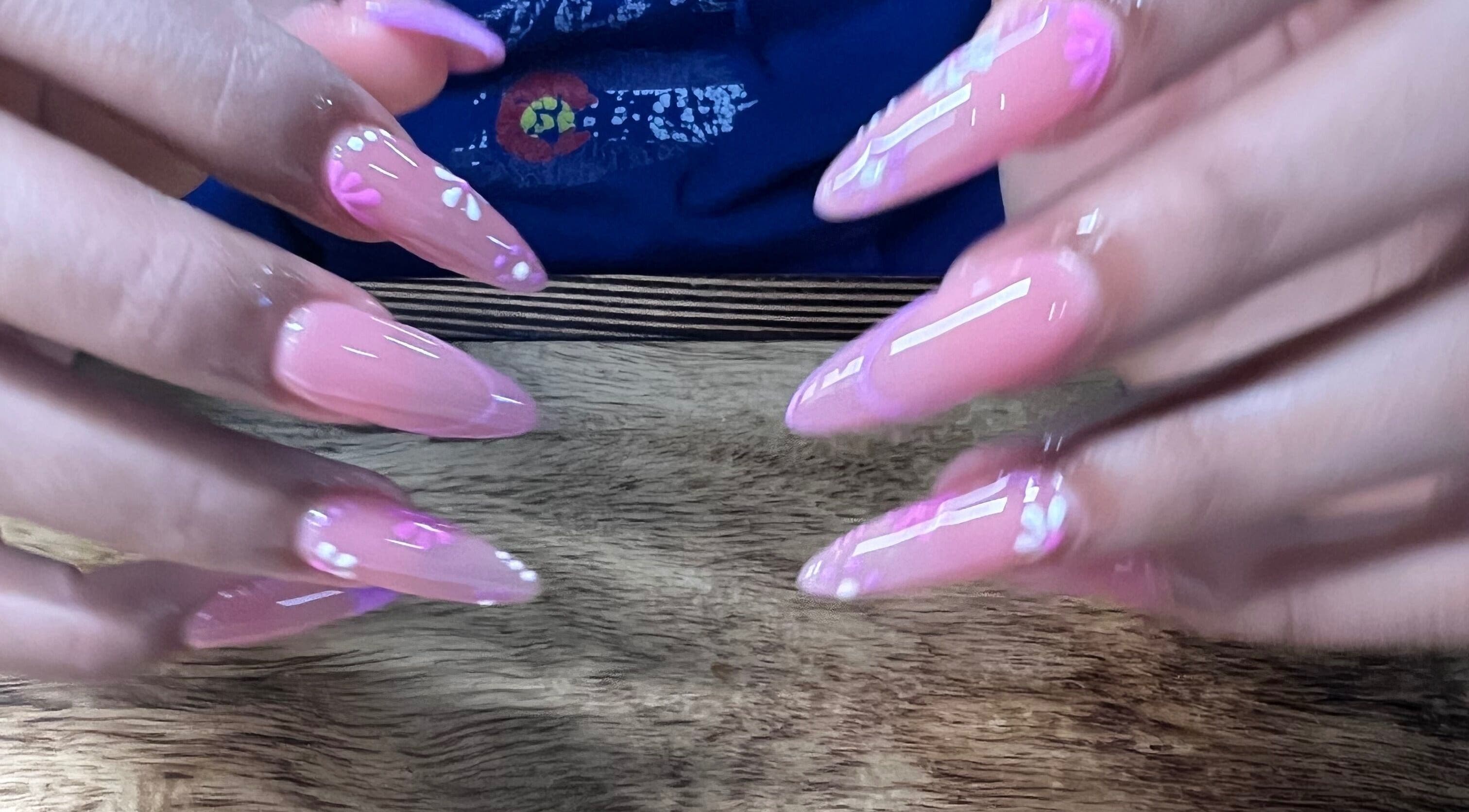 Elegant pink acrylic nails at Sweetie Skin and Nails in Greeley, Colorado, US.