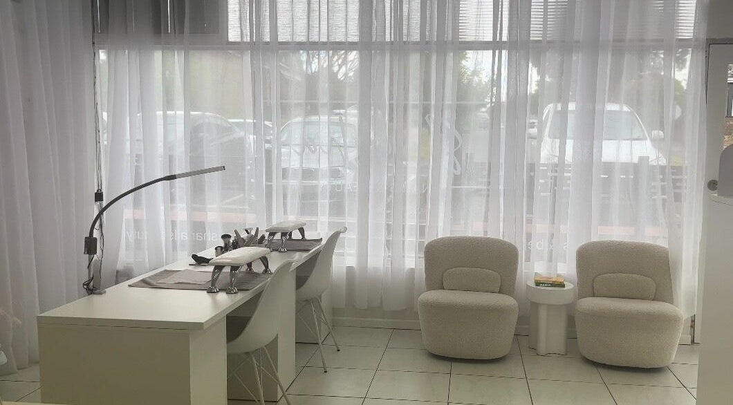 Bright, sleek interior of Saesha Nails and Beauty in Melbourne, Victoria, AU with modern nail stations.