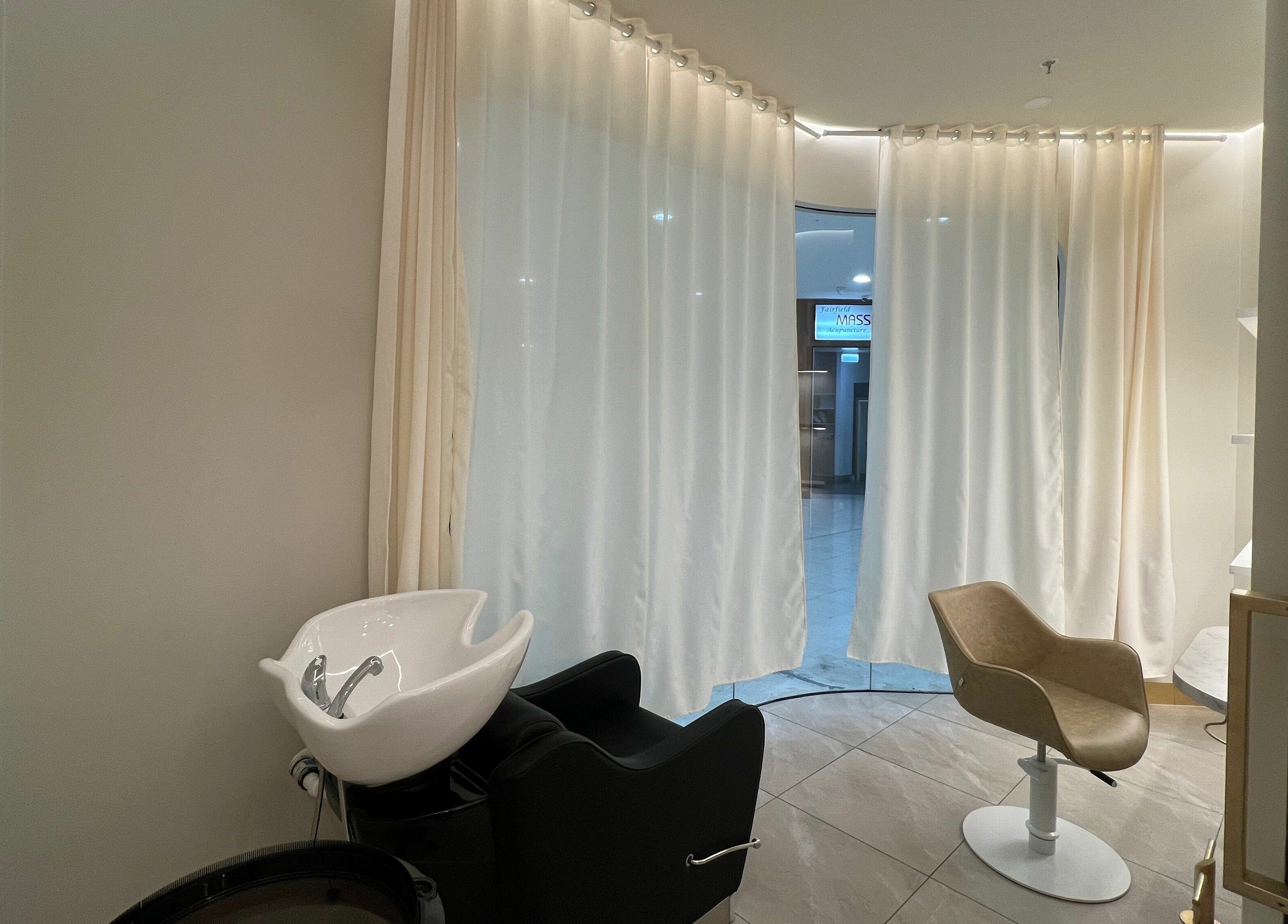 Elegant wash station and chair in Marvin Salon, Fairfield, New South Wales, AU with soft lighting.
