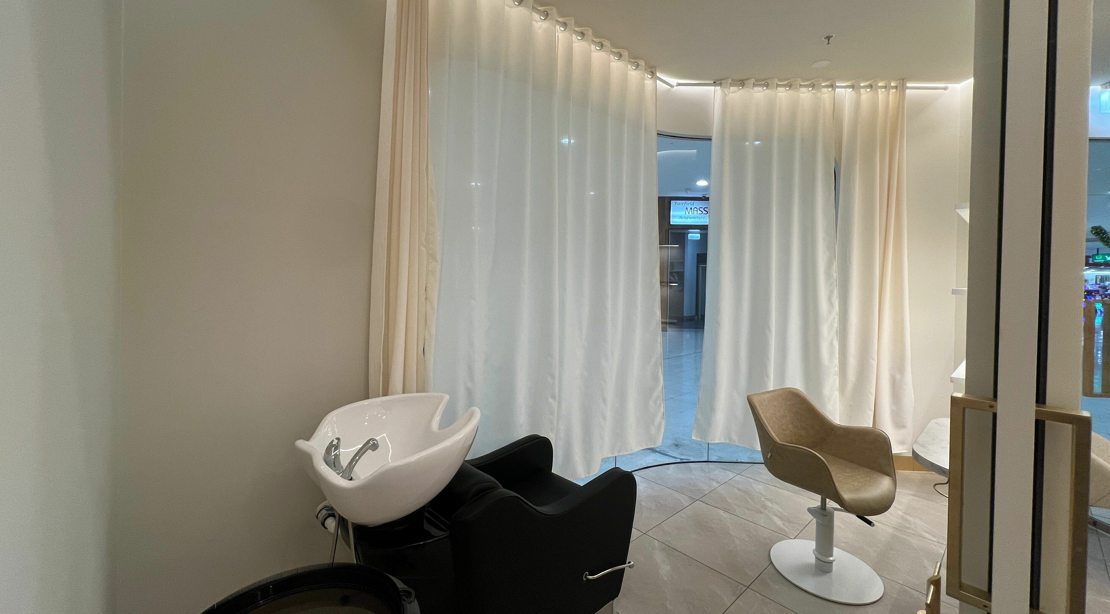 Elegant wash station and chair in Marvin Salon, Fairfield, New South Wales, AU with soft lighting.