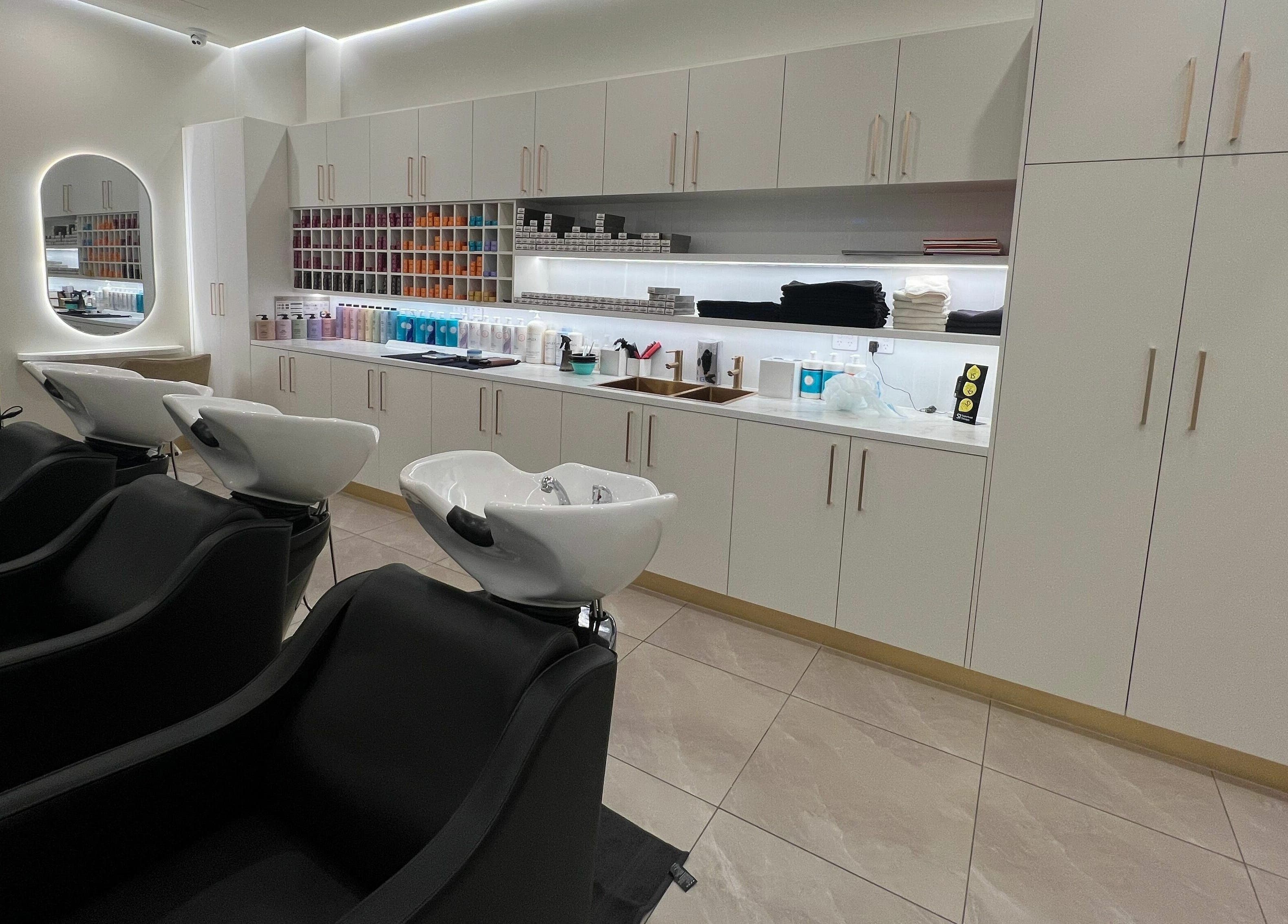 Modern wash stations at Marvin Salon, Fairfield, New South Wales, AU, showcasing sleek design and elegance.