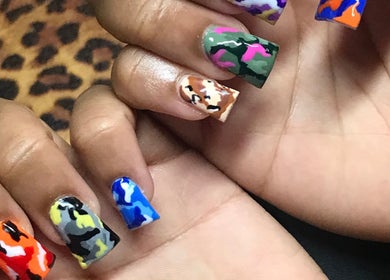 Colorful camo nail art by Grips by Shar in Toronto, Ontario, CA, showcasing bold patterns.