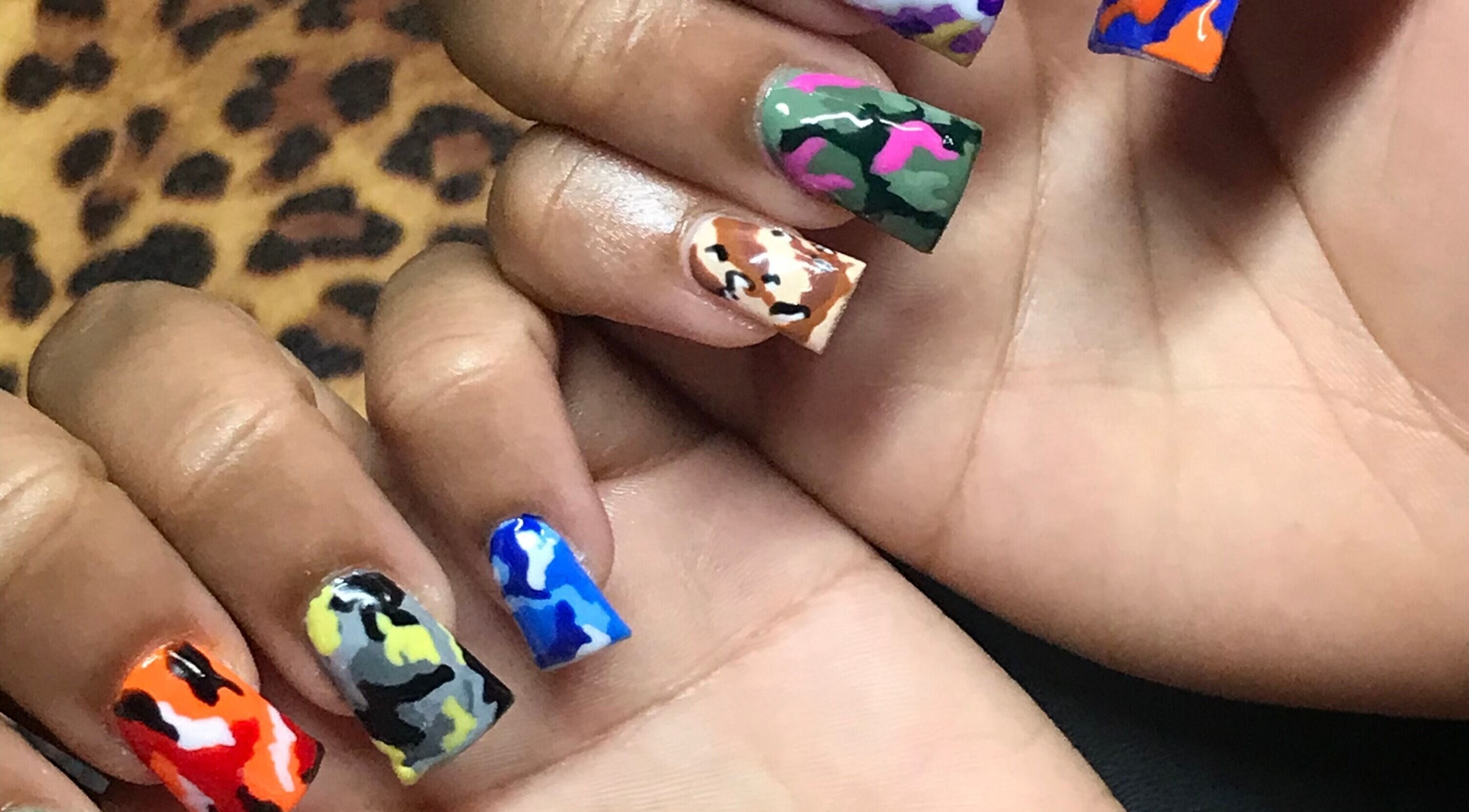 Colorful camo nail art by Grips by Shar in Toronto, Ontario, CA, showcasing bold patterns.