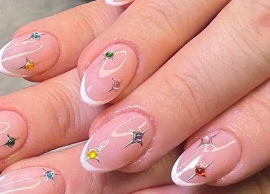 Elegant nail art with gems at Grips by Shar, Toronto, Ontario, CA, showcasing intricate design and style.
