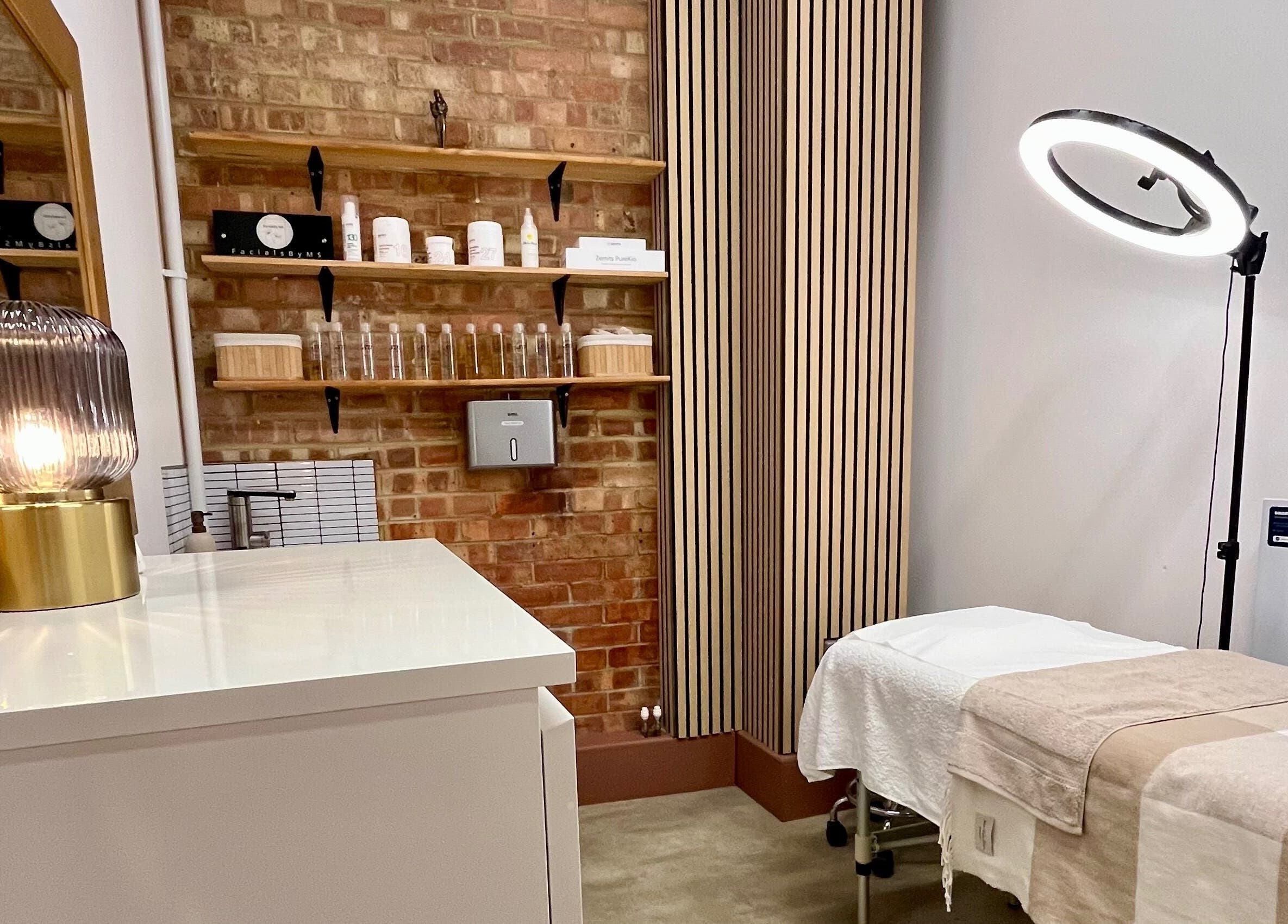 Facials by MS cozy treatment room with ambient lighting in Sutton, England, GB.