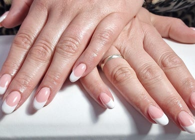 Beautiful French manicure at Lisa Luxe Treatments, Birmingham, England, GB. Showcasing elegance and precision.