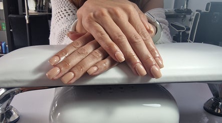 Elegant nude manicure on hands at Lisa Luxe Treatments, Birmingham, England, GB.