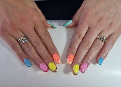 Vibrant nail art at Lisa Luxe Treatments in Birmingham, England, GB showcasing colorful, glossy manicures.