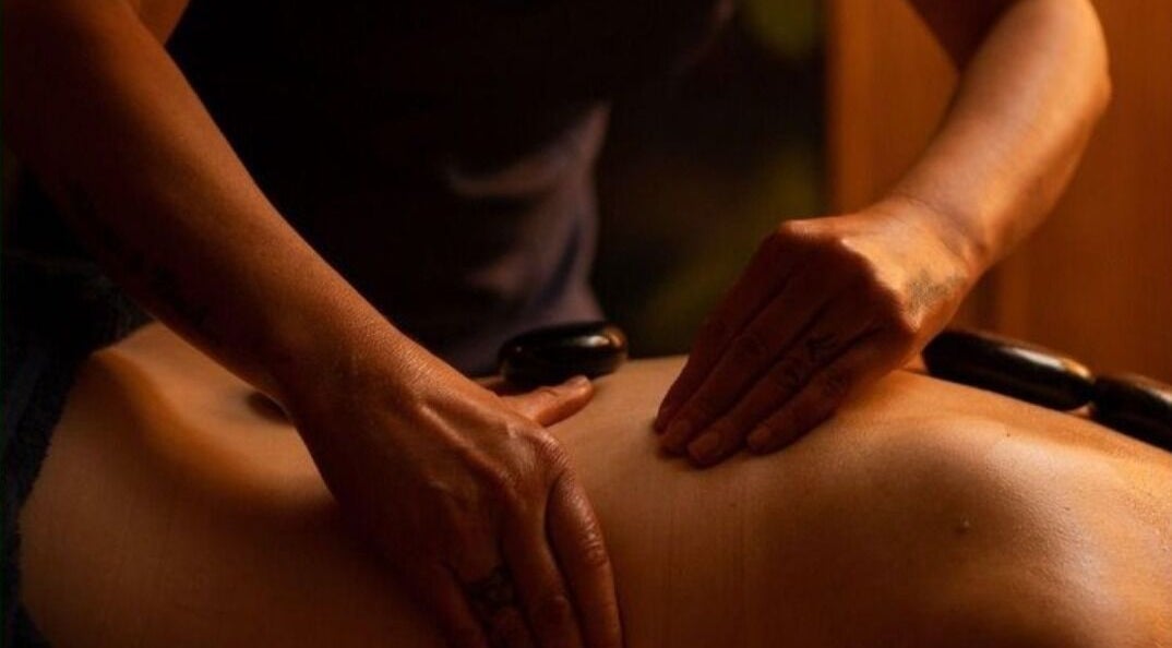 A relaxing hot stone massage at Jun Lin Spa - Glenorchy, Glenorchy, Tasmania, AU enhancing well-being.