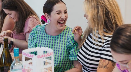 Guests laughing and socializing at Clay and Slay Newcastle, Wickham, New South Wales, AU.