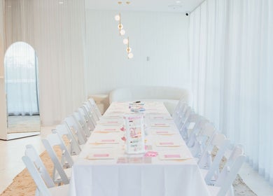 Elegant event setup at Clay and Slay Newcastle in Wickham, New South Wales, AU with white decor and table seating.