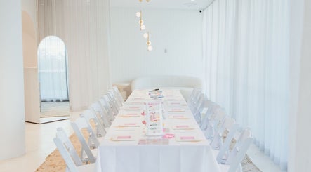 Elegant event setup at Clay and Slay Newcastle in Wickham, New South Wales, AU with white decor and table seating.