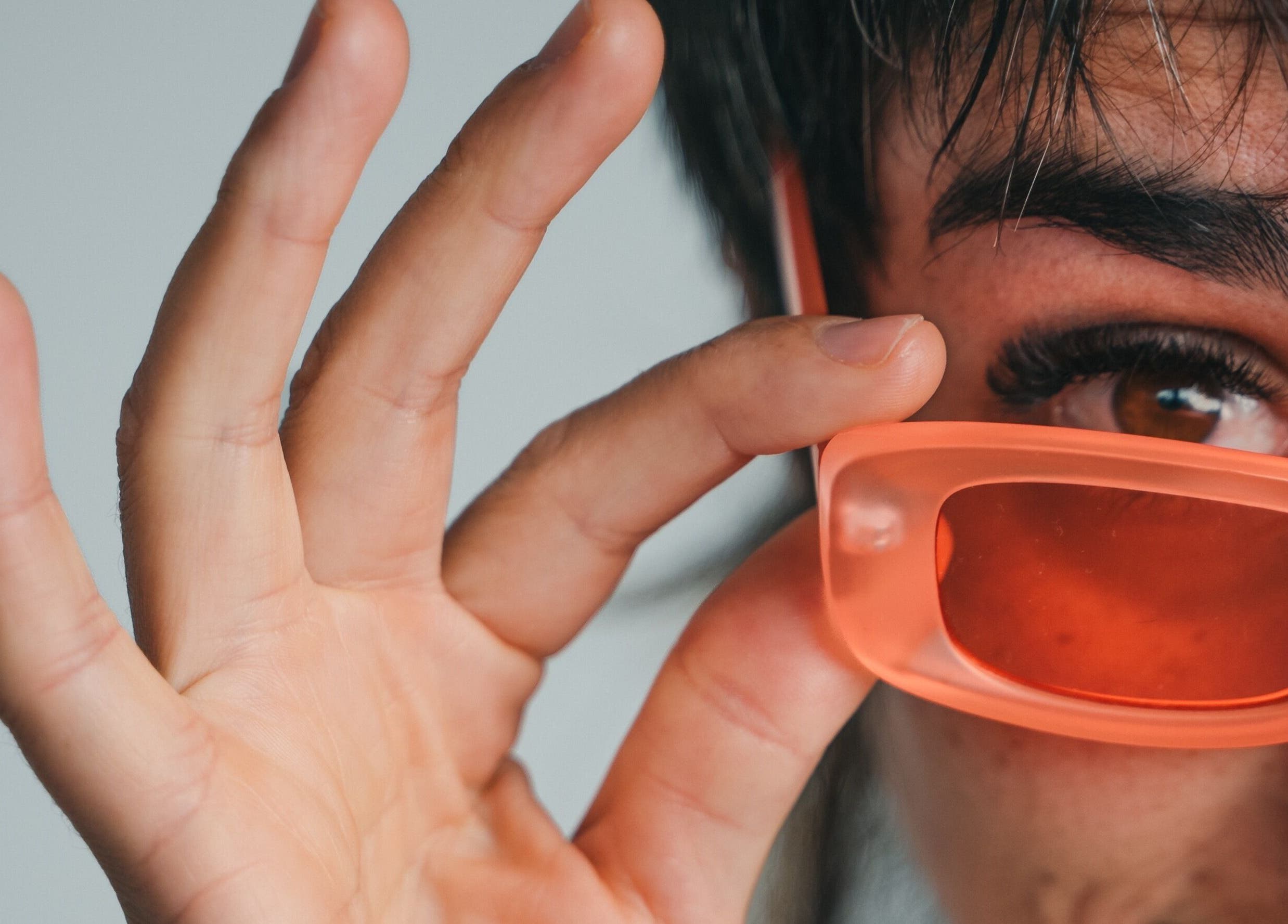 Close-up of a person with peach sunglasses at The Cocoon CBR, Phillip, Australian Capital Territory, AU.