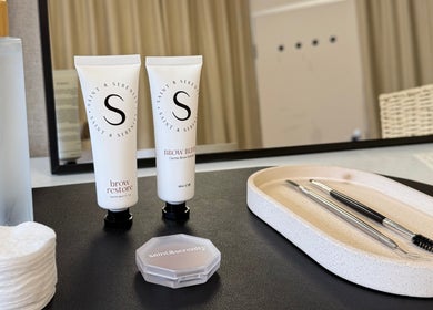 Brow care products and tools at Mabel Studio, Blantyre, Scotland, GB, showcasing a serene beauty setup.