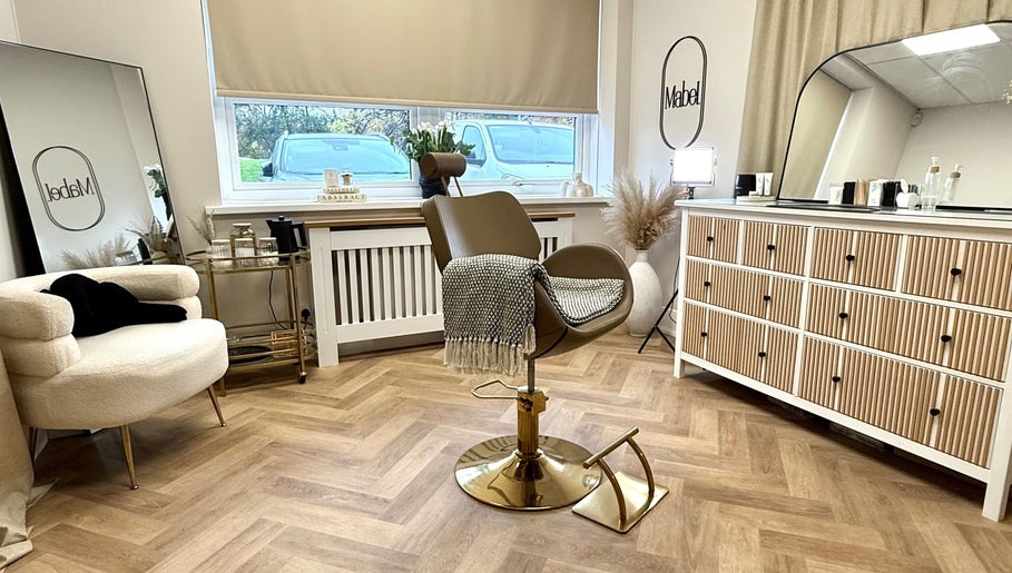 Modern beauty chair in serene room at Mabel Studio, Blantyre, Scotland, GB, showcasing cozy elegance.