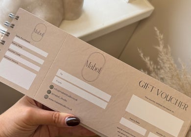 Close-up of Mabel Studio gift voucher held in Blantyre, Scotland, GB showcasing elegant design.