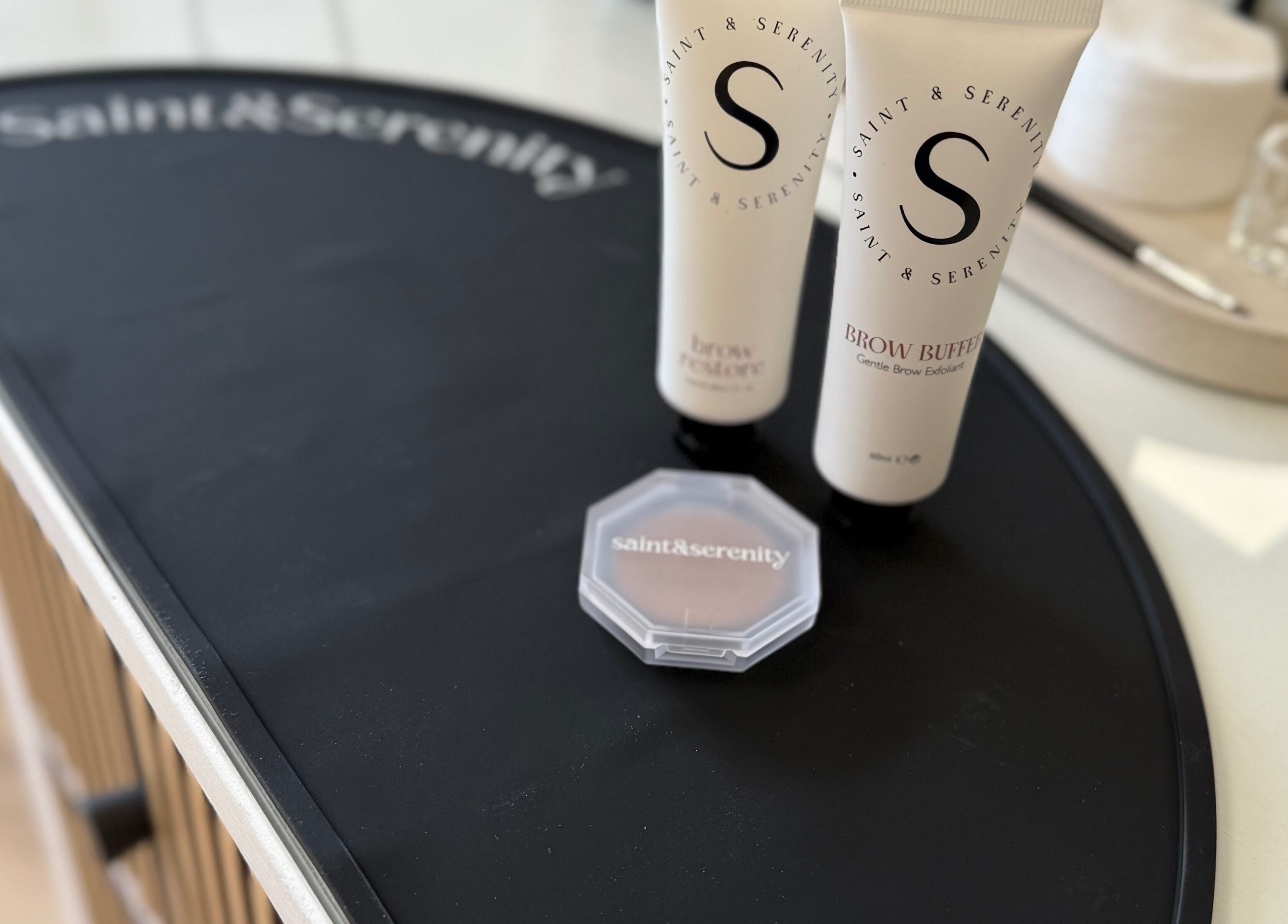 Beauty products at Mabel Studio, Blantyre, Scotland, GB, highlighting Saint & Serenity branding.