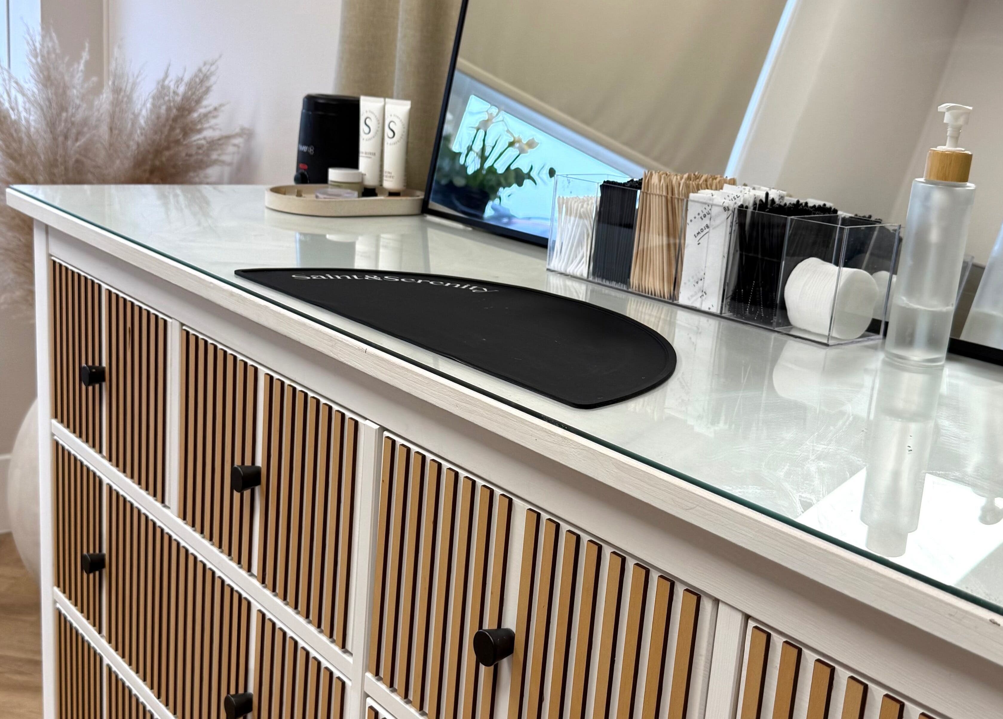 Stylish vanity setup at Mabel Studio, Blantyre, Scotland, GB with decor and beauty products.