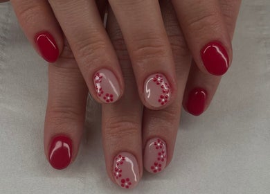 Elegant red nail art at The Beauty Drop Norwich, Blofield, England, GB—perfect polka dot design.