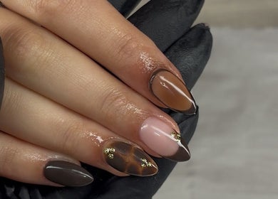 Elegant nail designs at The Beauty Drop Norwich, Blofield, England, GB. Featuring chic brown and pink shades.