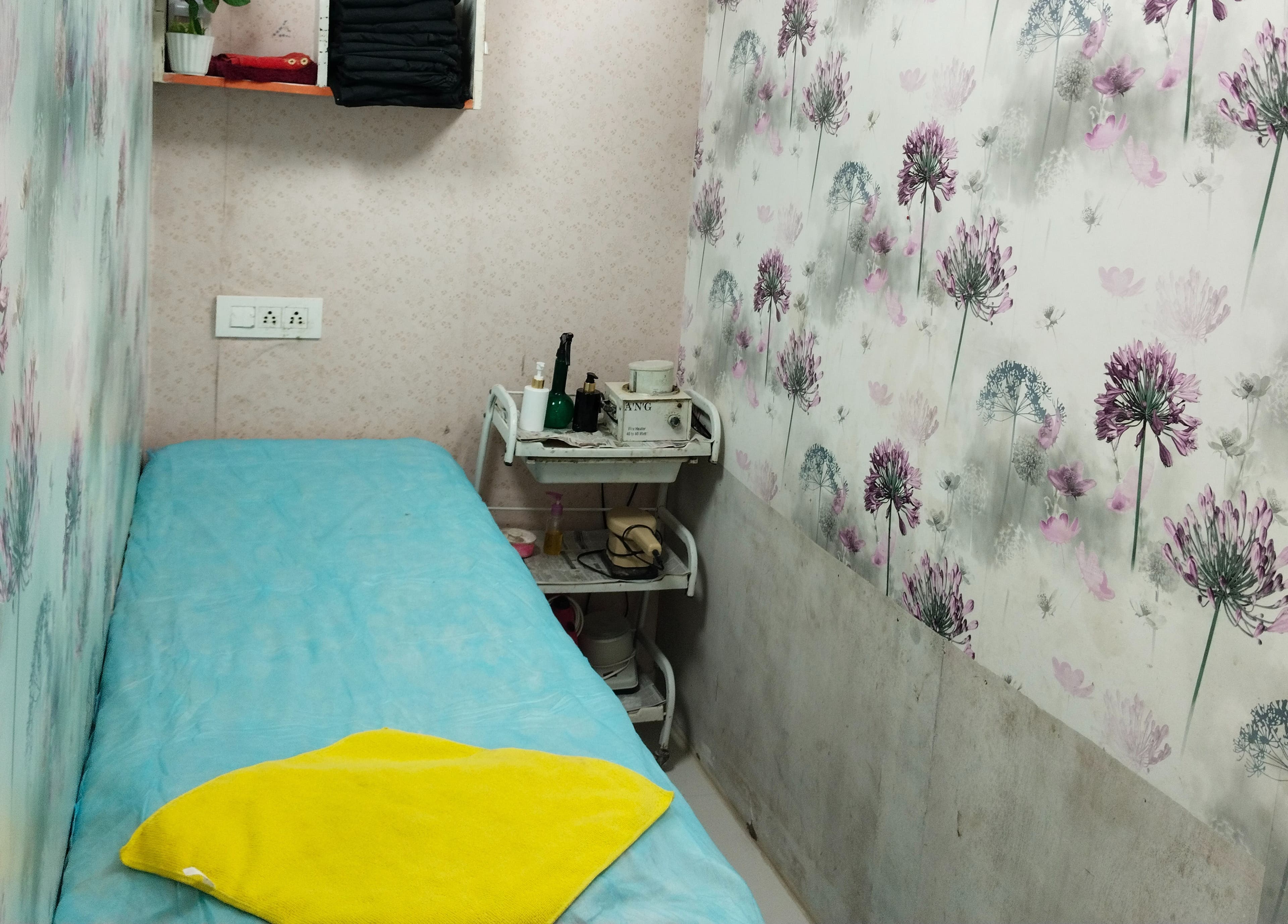 Tranquil treatment room at Geet Salon Professional (for Ladies), Noida, Uttar Pradesh, IN, with floral decor.