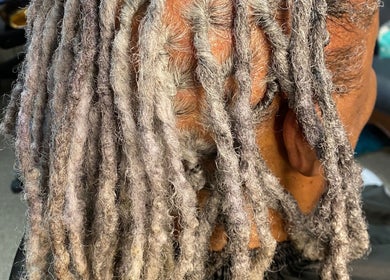 Detailed view of silvery dreadlocks at TBH Tha Black Hippie in Oroville, California, US.