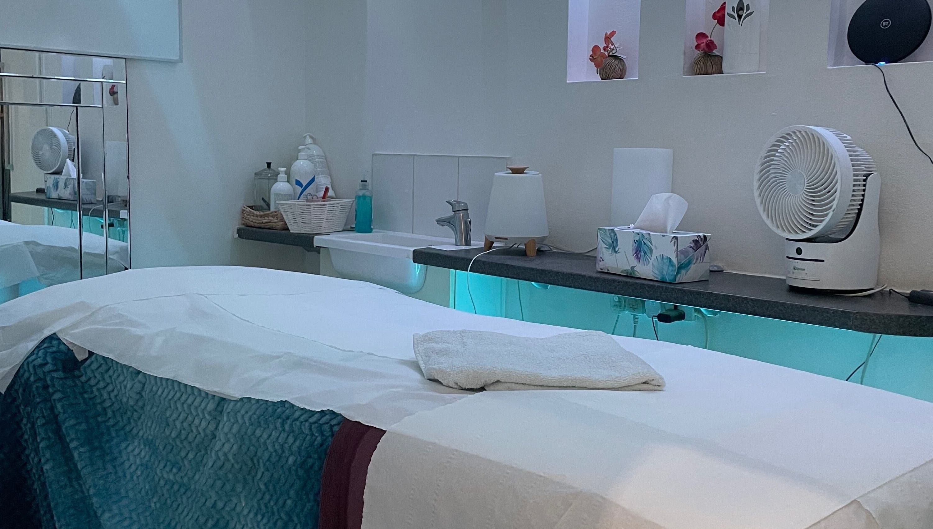 Peaceful therapy room at Serene Spa London, featuring a massage table and calming decor. Location: London, England, GB.