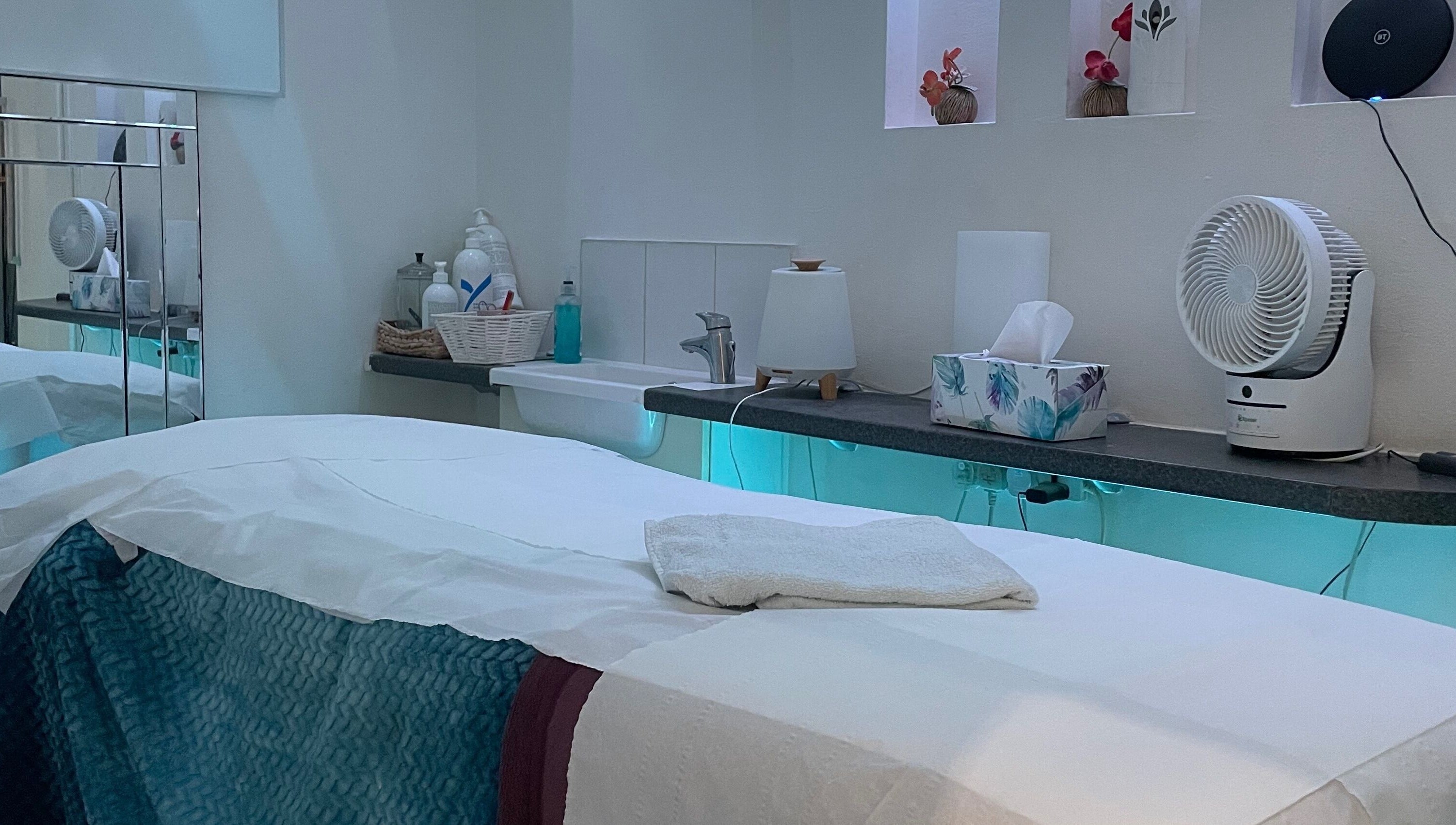 Peaceful therapy room at Serene Spa London, featuring a massage table and calming decor. Location: London, England, GB.