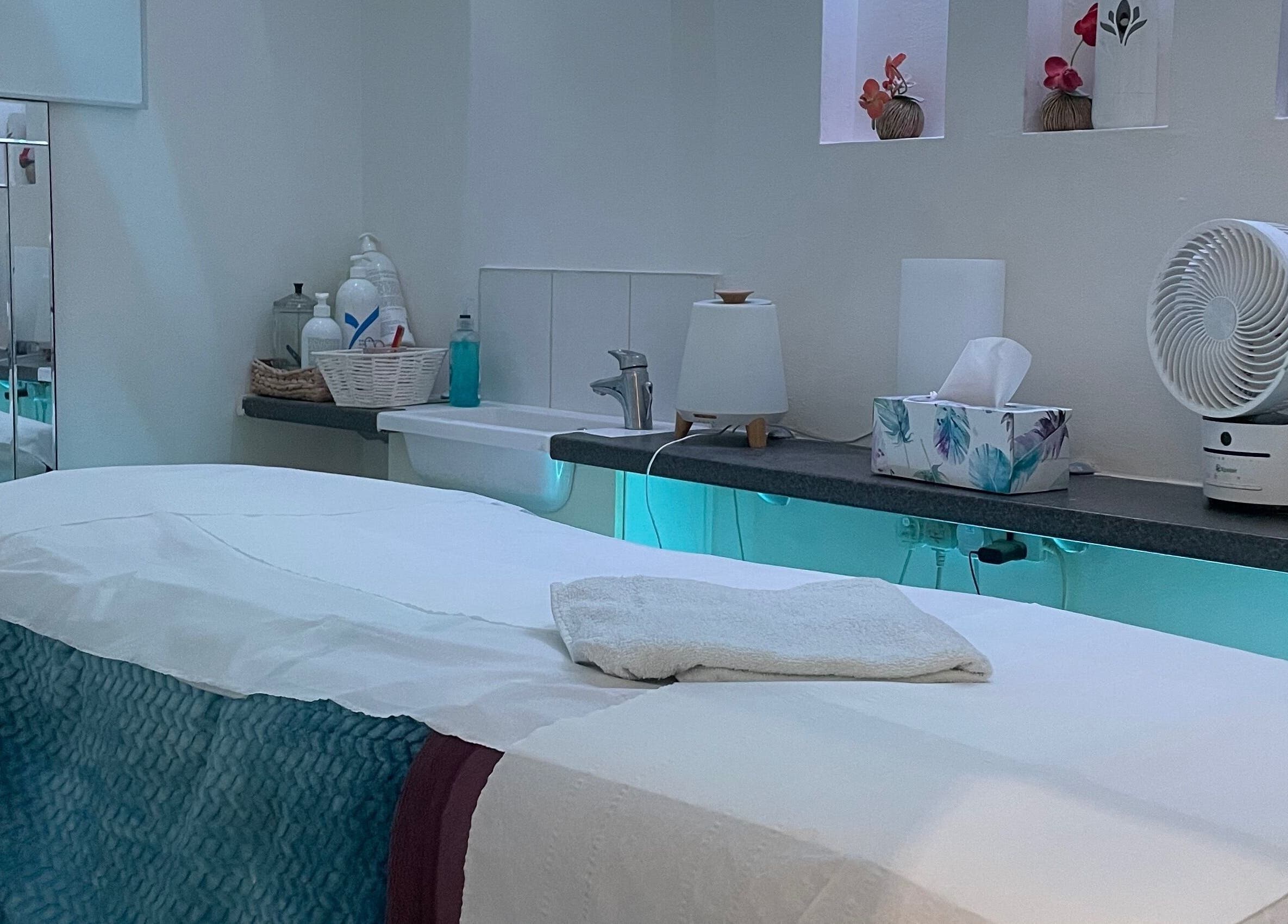 Peaceful therapy room at Serene Spa London, featuring a massage table and calming decor. Location: London, England, GB.