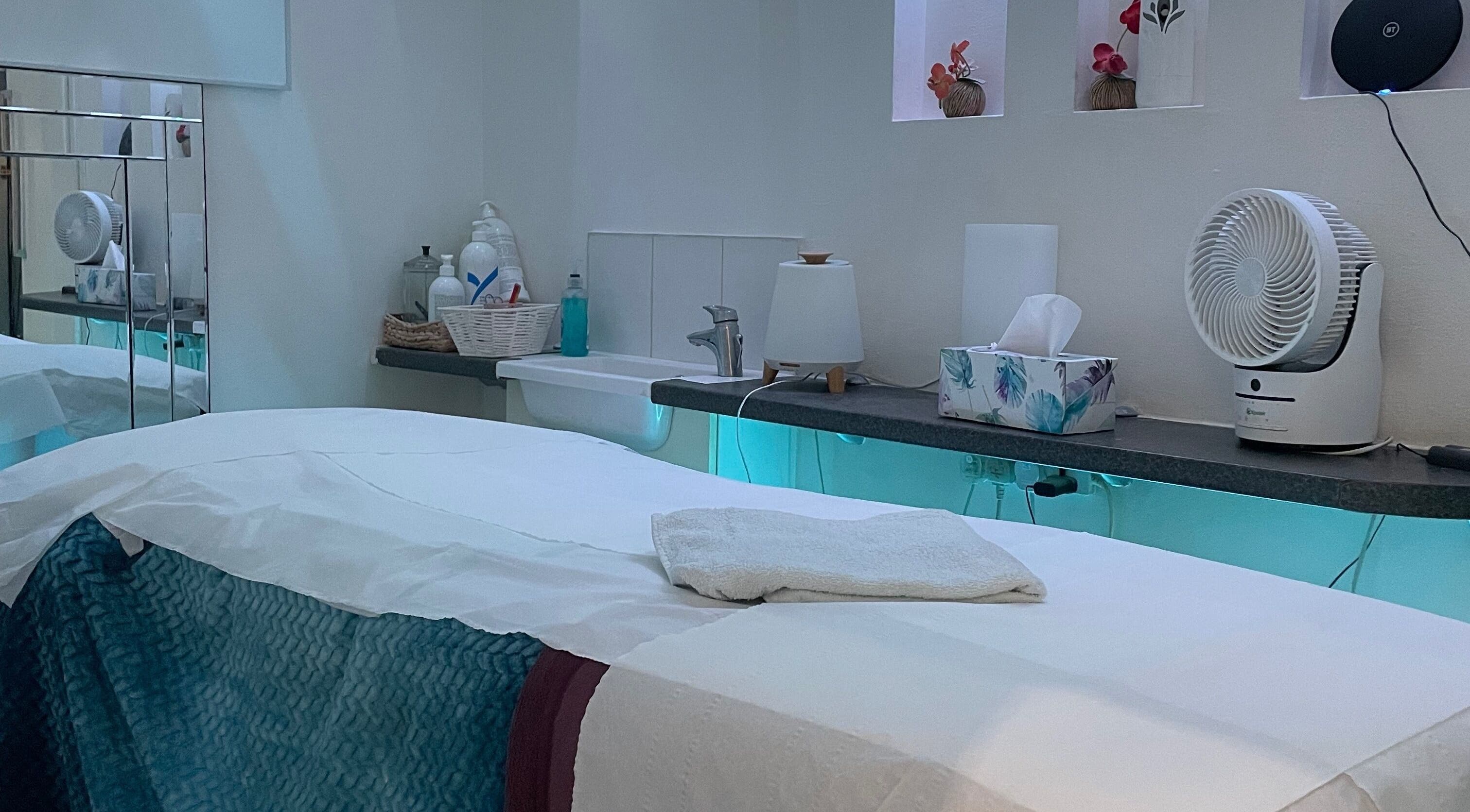 Peaceful therapy room at Serene Spa London, featuring a massage table and calming decor. Location: London, England, GB.