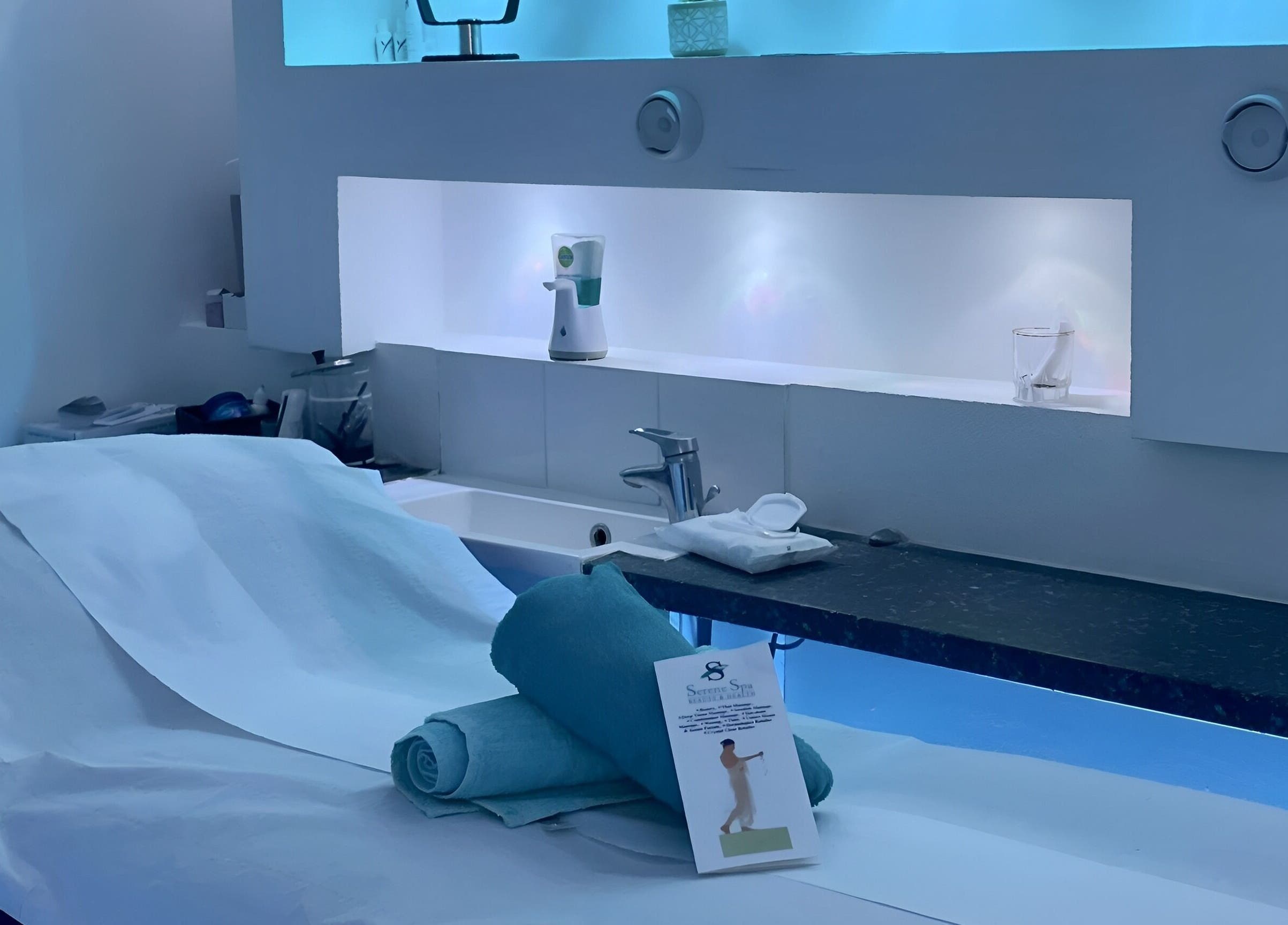 Serene Spa London in London, England, GB, showcasing a tranquil treatment room with ambient lighting.