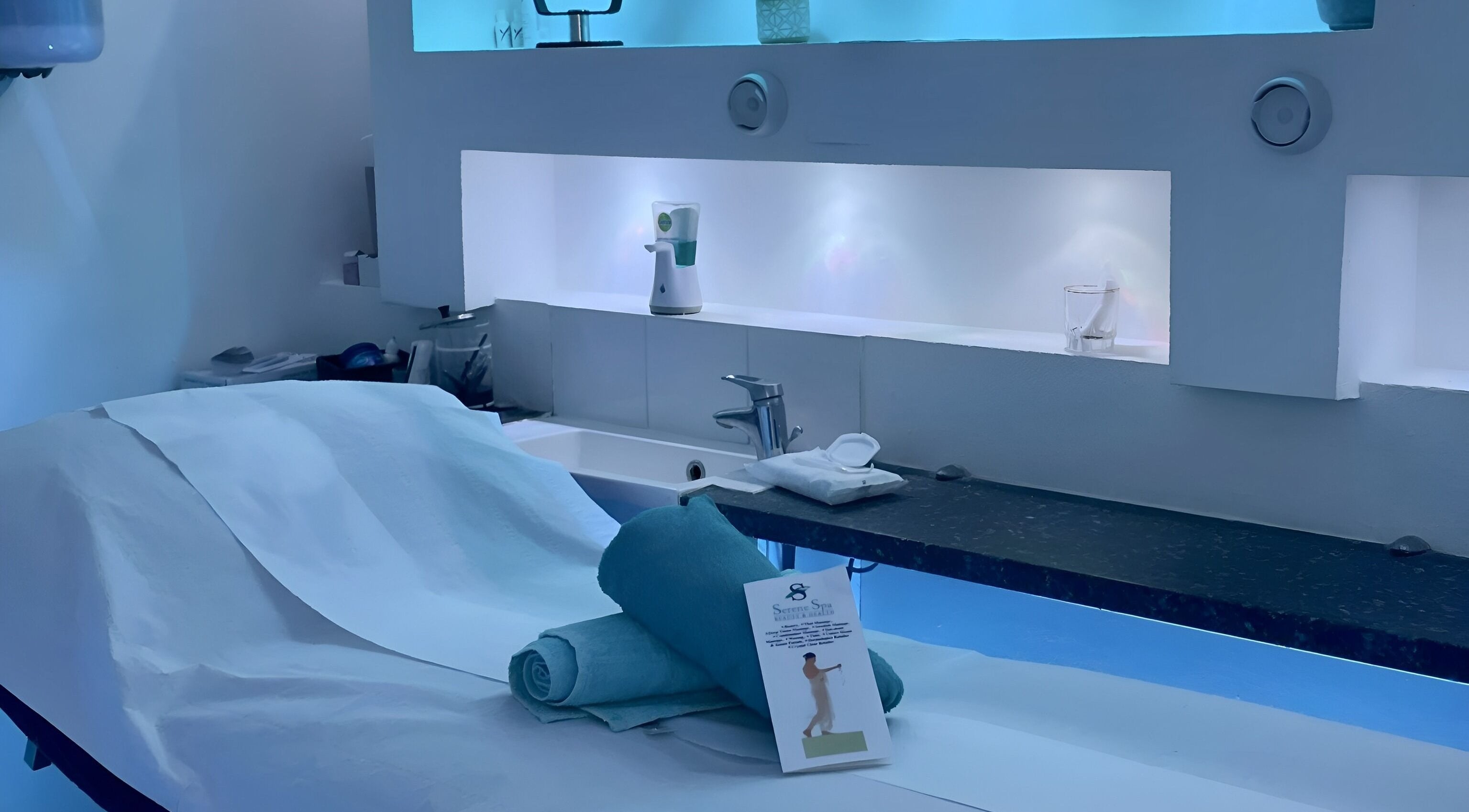 Serene Spa London in London, England, GB, showcasing a tranquil treatment room with ambient lighting.