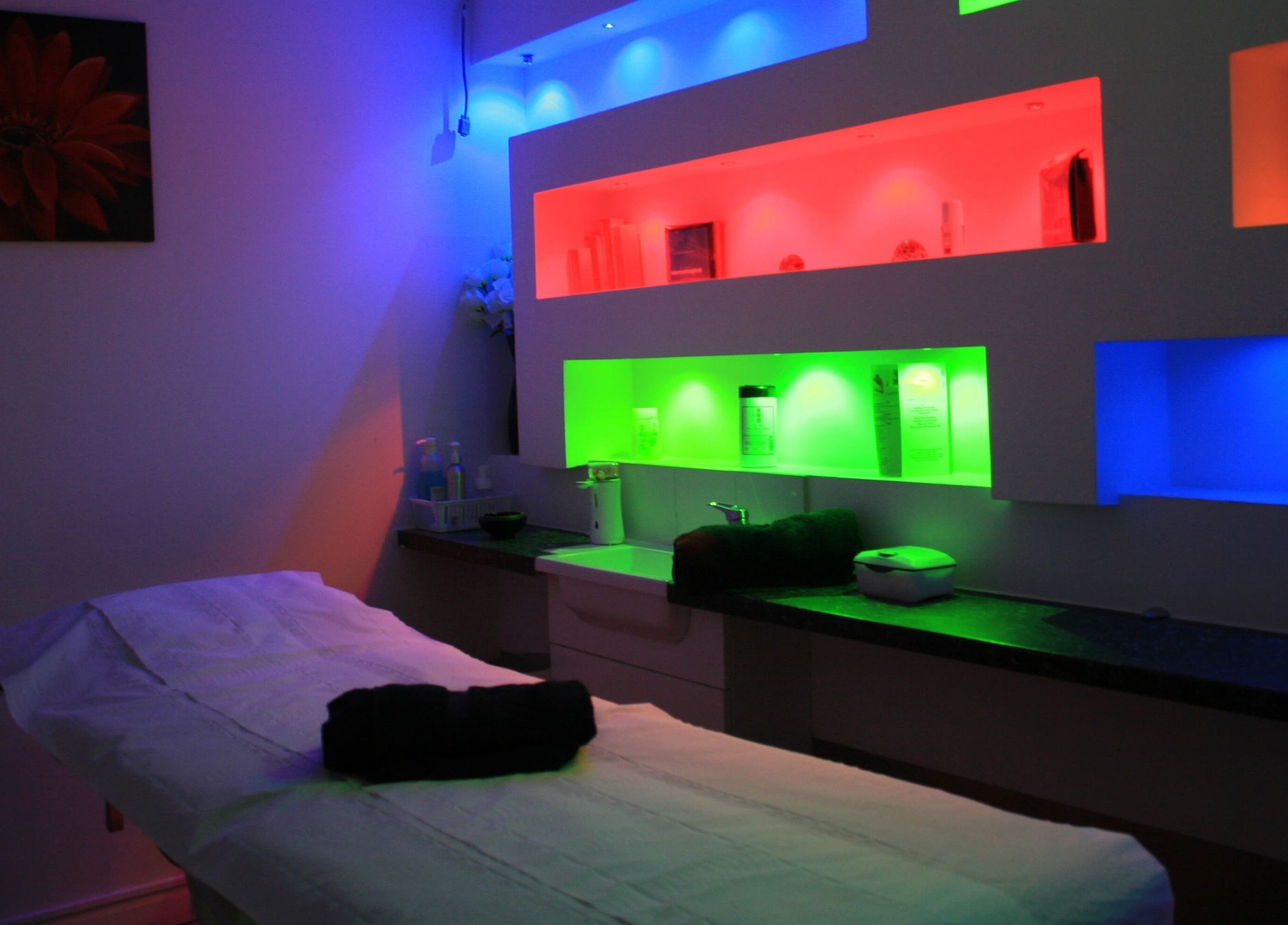 Colorful ambient lighting in treatment room at Serene Spa London, London, England, GB.