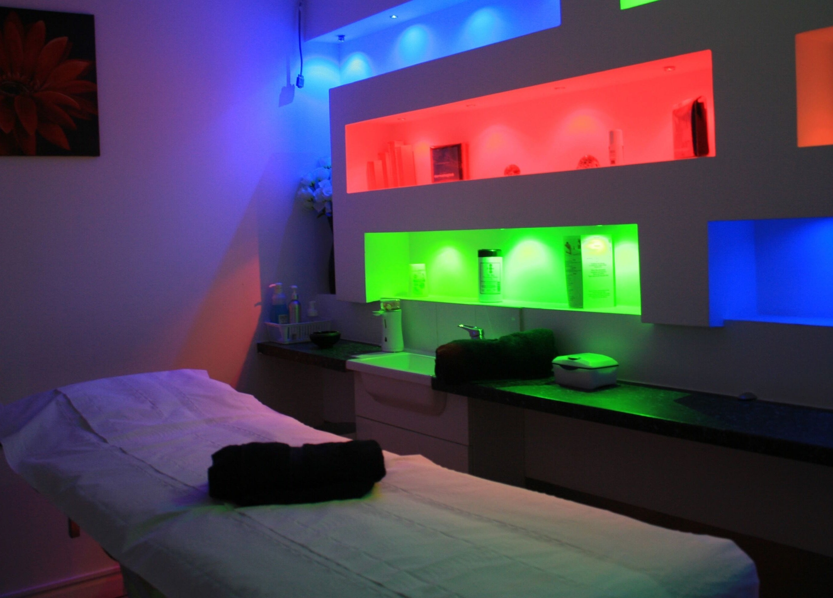 Colorful ambient lighting in treatment room at Serene Spa London, London, England, GB.
