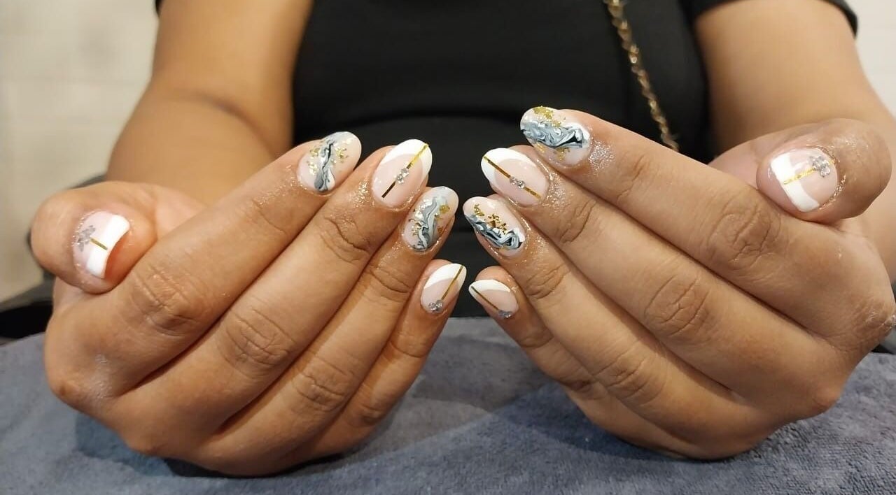 Elegant marble nail art at Golden Nail Bar, Subang Jaya, Selangor, MY. Intricate designs with glossy finish.