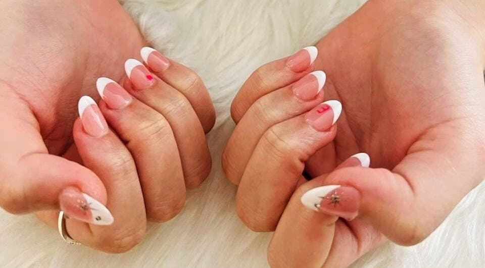 Elegant French manicure with nail art at Golden Nail Bar, Subang Jaya, Selangor, MY.