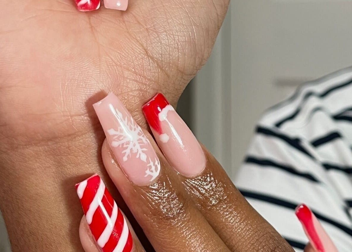 Holiday-themed nail art at Nailvault by Chels, Cape Town, Western Cape, ZA showcasing red and white designs.