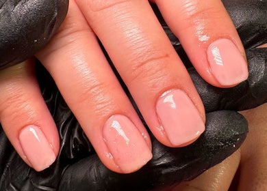 Detailed view of manicured nails with a soft pink polish at Nūse Aesthetics, Nottingham, England, GB.