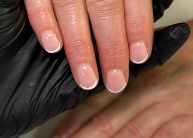 Elegant French manicure at Nūse Aesthetics, Nottingham, England, GB, showcasing precision and style.