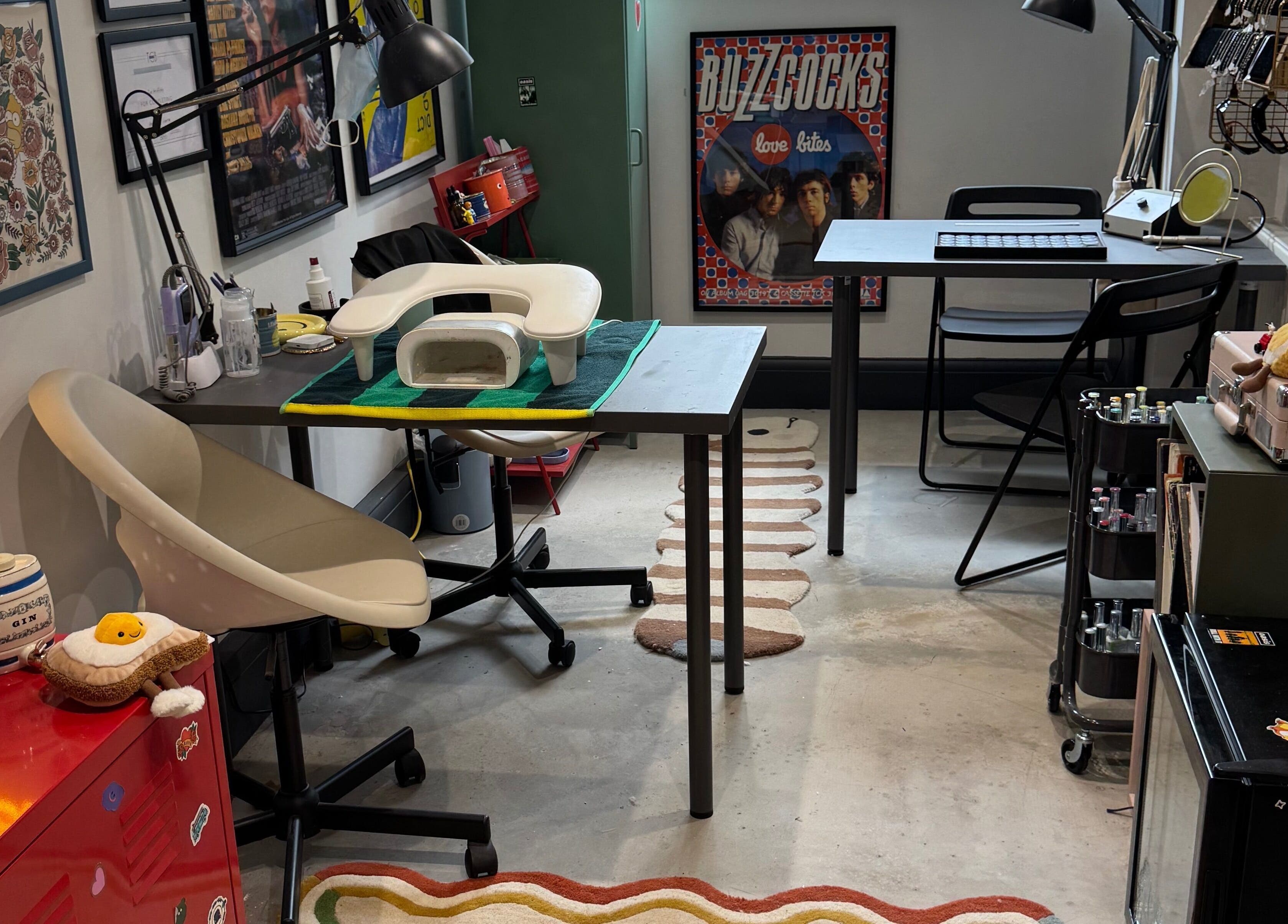 Griff’s Gel Studio in Urmston, England, features a quirky workspace with artistic decor and modern nail equipment.