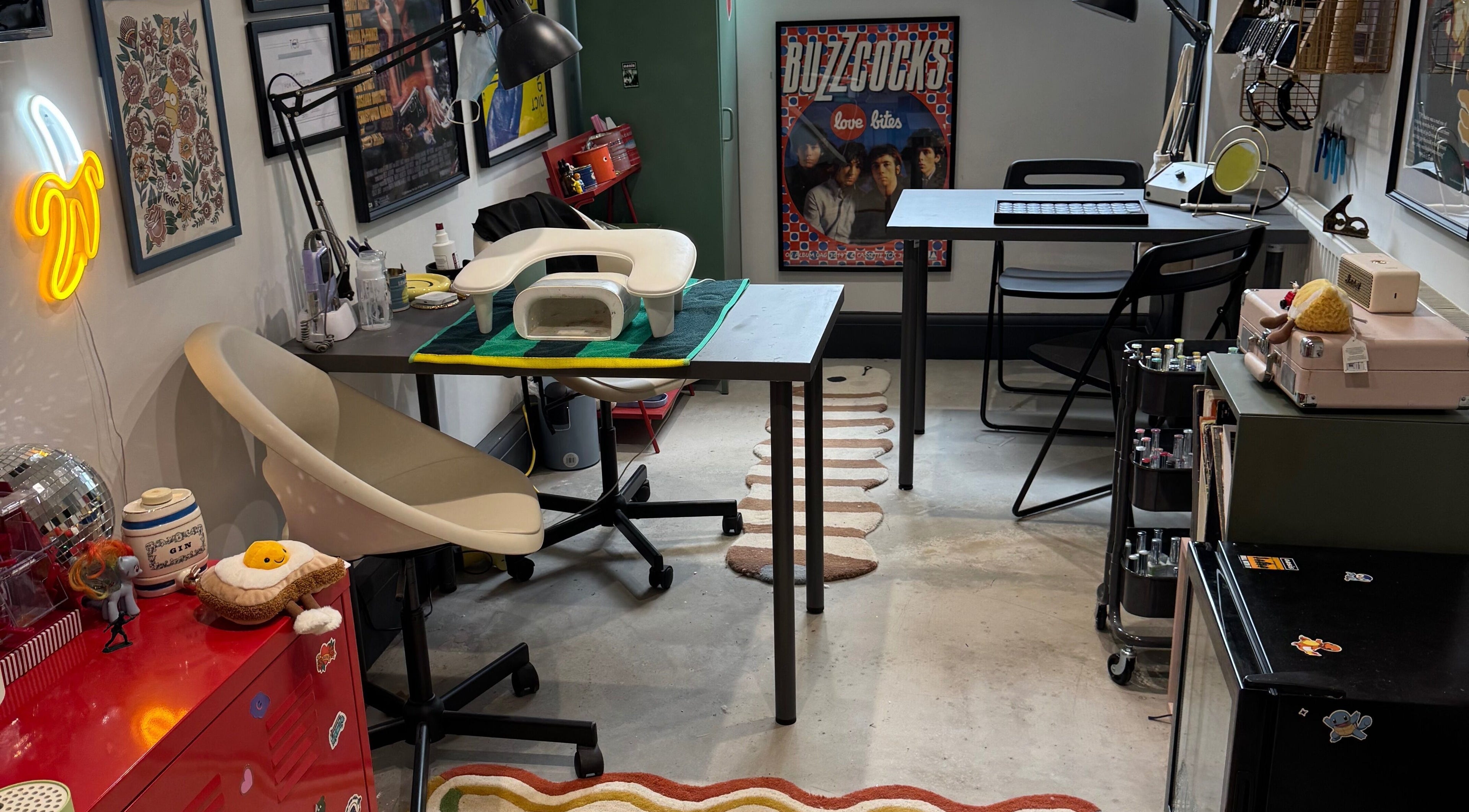 Griff’s Gel Studio in Urmston, England, features a quirky workspace with artistic decor and modern nail equipment.