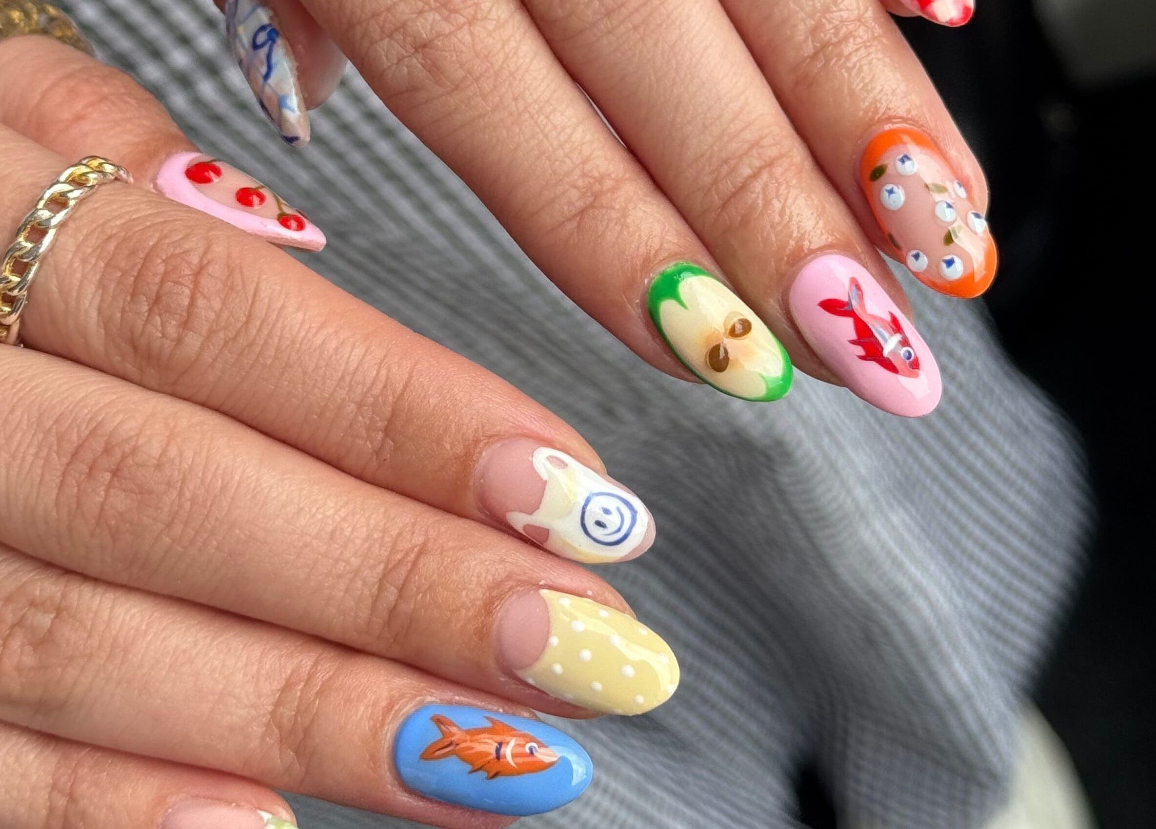 Colorful nail art design at Griff’s Gel Studio, Urmston, England, GB showcasing unique hand-painted details.