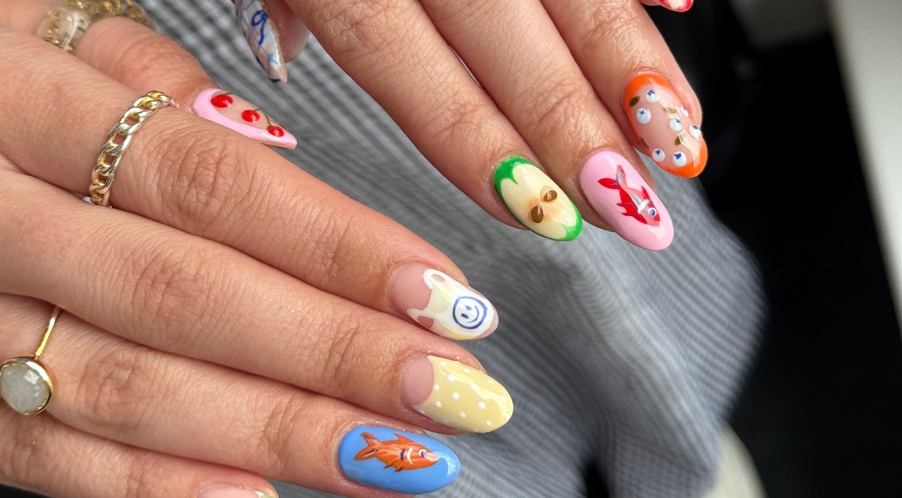 Colorful nail art design at Griff’s Gel Studio, Urmston, England, GB showcasing unique hand-painted details.