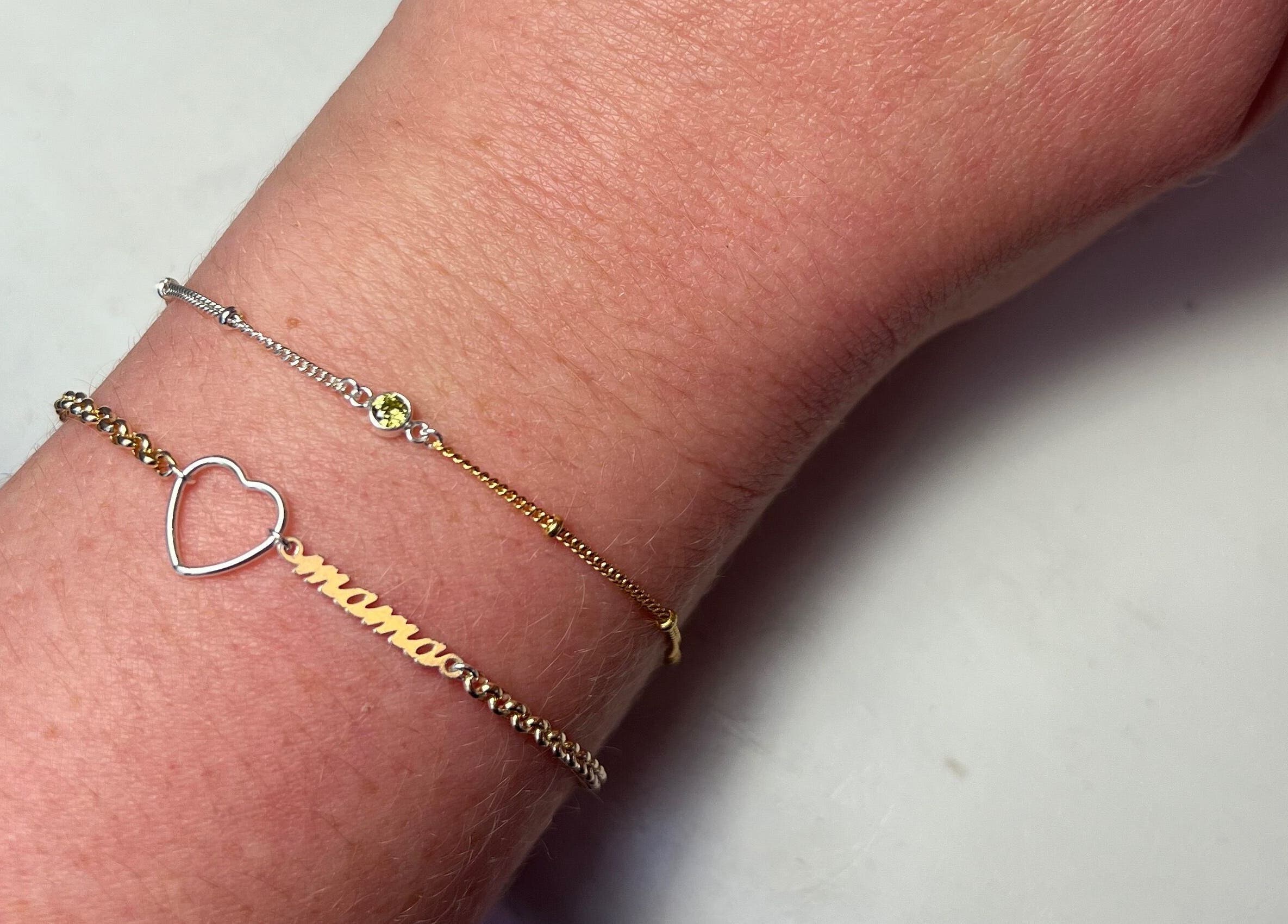 Close-up of wrist with elegant bracelets at Griff’s Gel Studio, Manchester, England, GB.