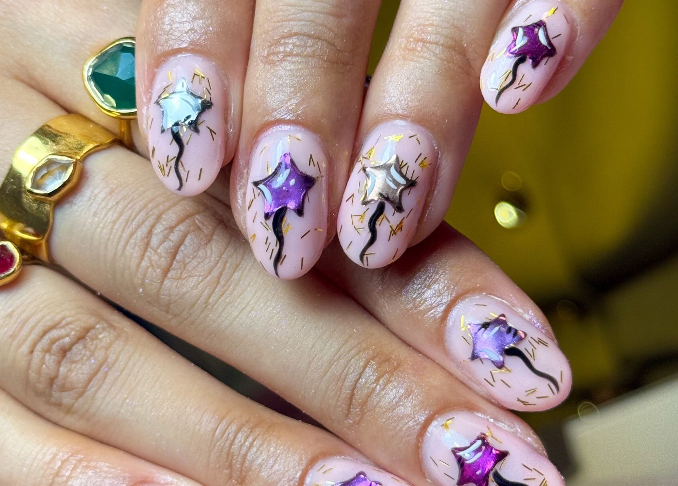 Elegant star-patterned manicure at Griff’s Gel Studio in Manchester, England, GB showcasing intricate nail art.