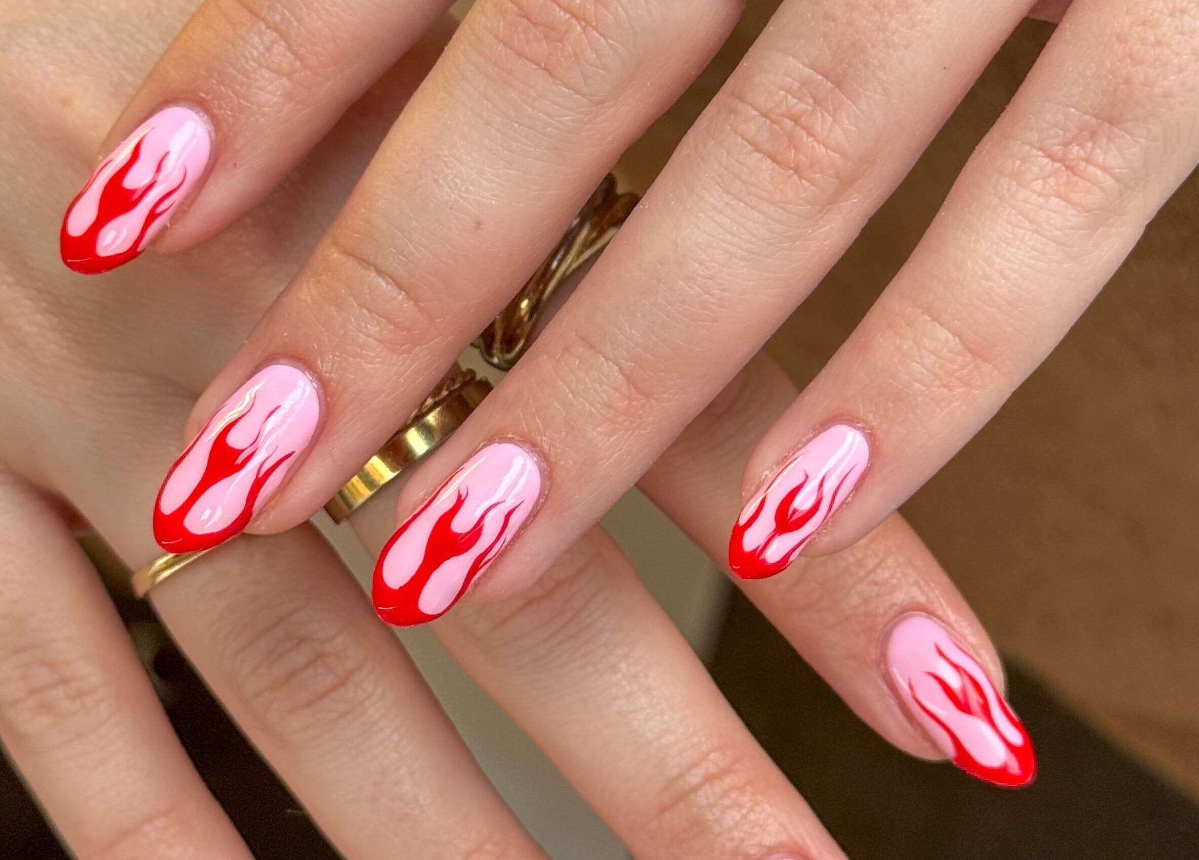 Red flame nail art at Griff’s Gel Studio in Manchester, England, GB, showcasing unique creative designs.