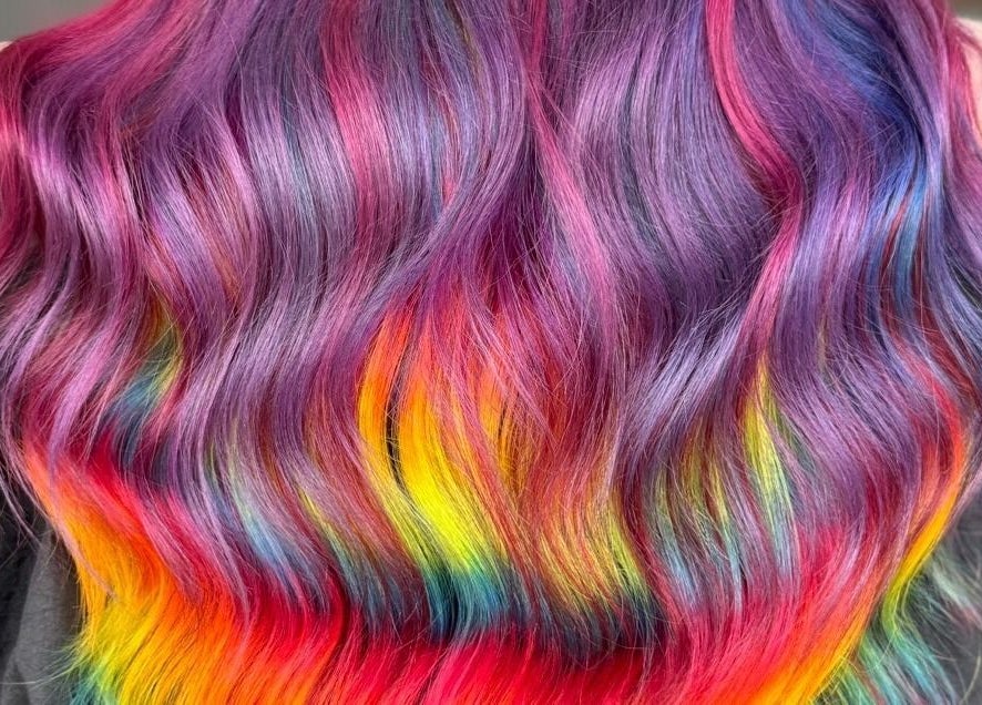 Vibrant rainbow hair styling at The Lavender Loft, Cardiff, Wales, GB.