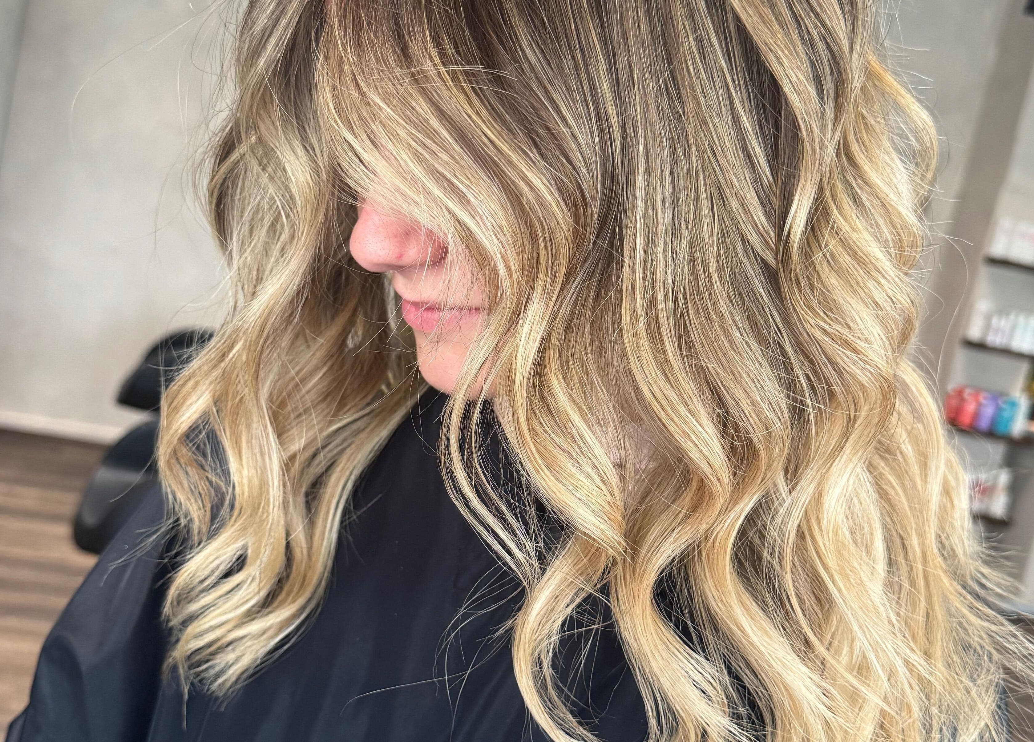 Stylish wavy blonde hairstyle at The Lavender Loft, Cardiff, Wales, GB salon.