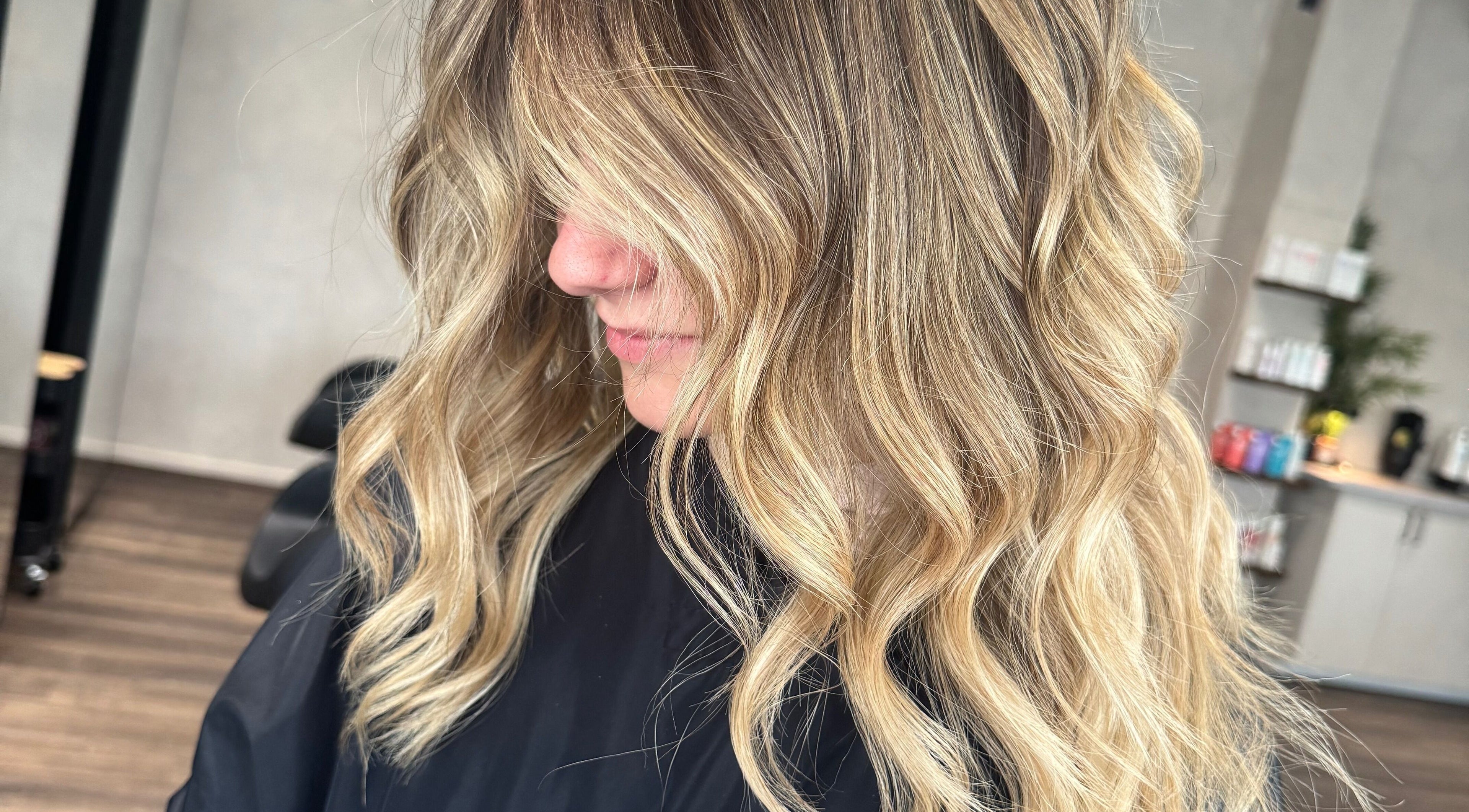 Stylish wavy blonde hairstyle at The Lavender Loft, Cardiff, Wales, GB salon.