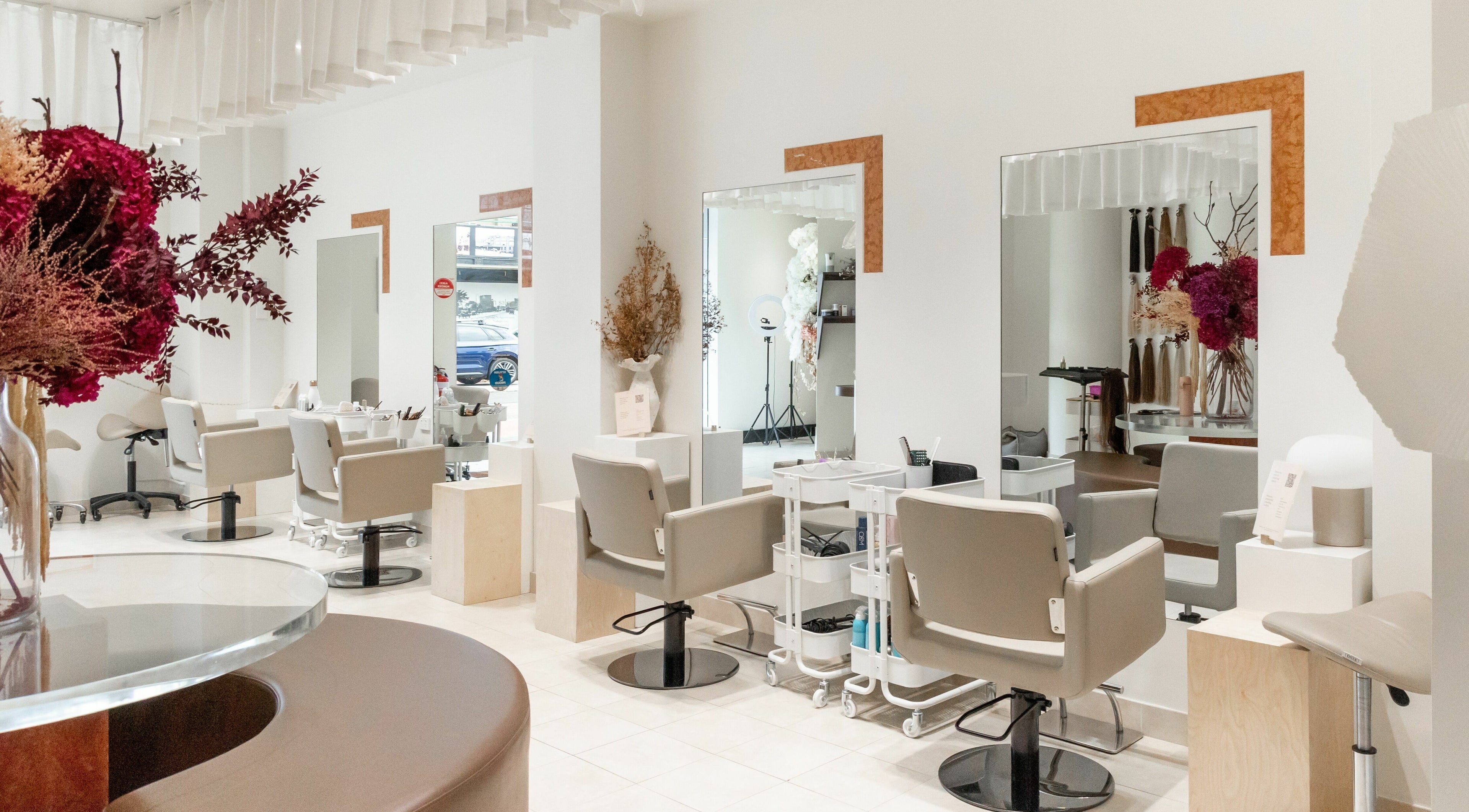 Modern salon interior at Ren Salon, Paddington, New South Wales, AU, featuring stylish chairs and mirrors.